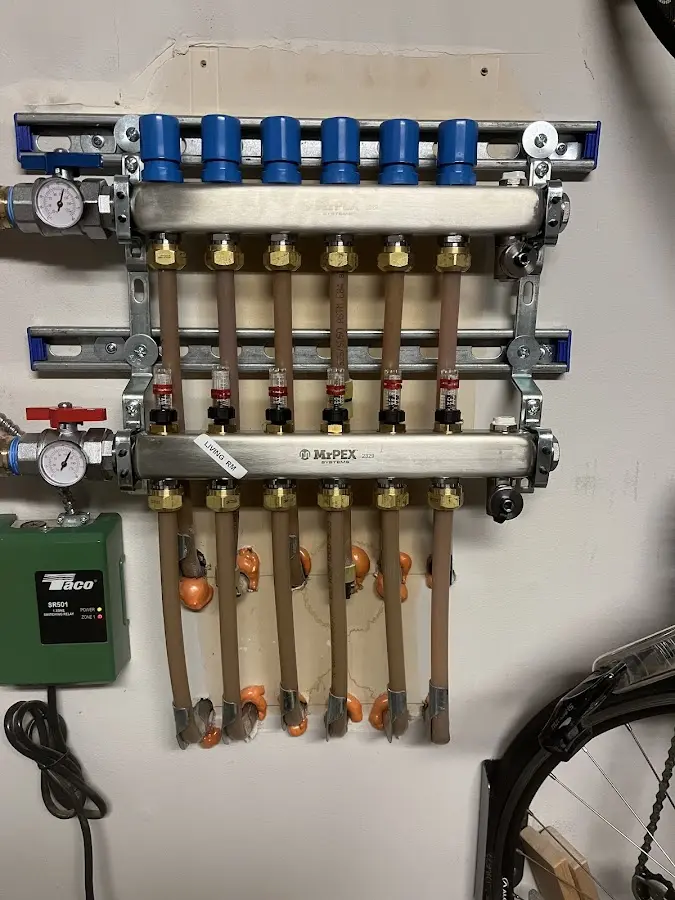 Plumber performing Water Heater Repair at a residential property in Spencerport